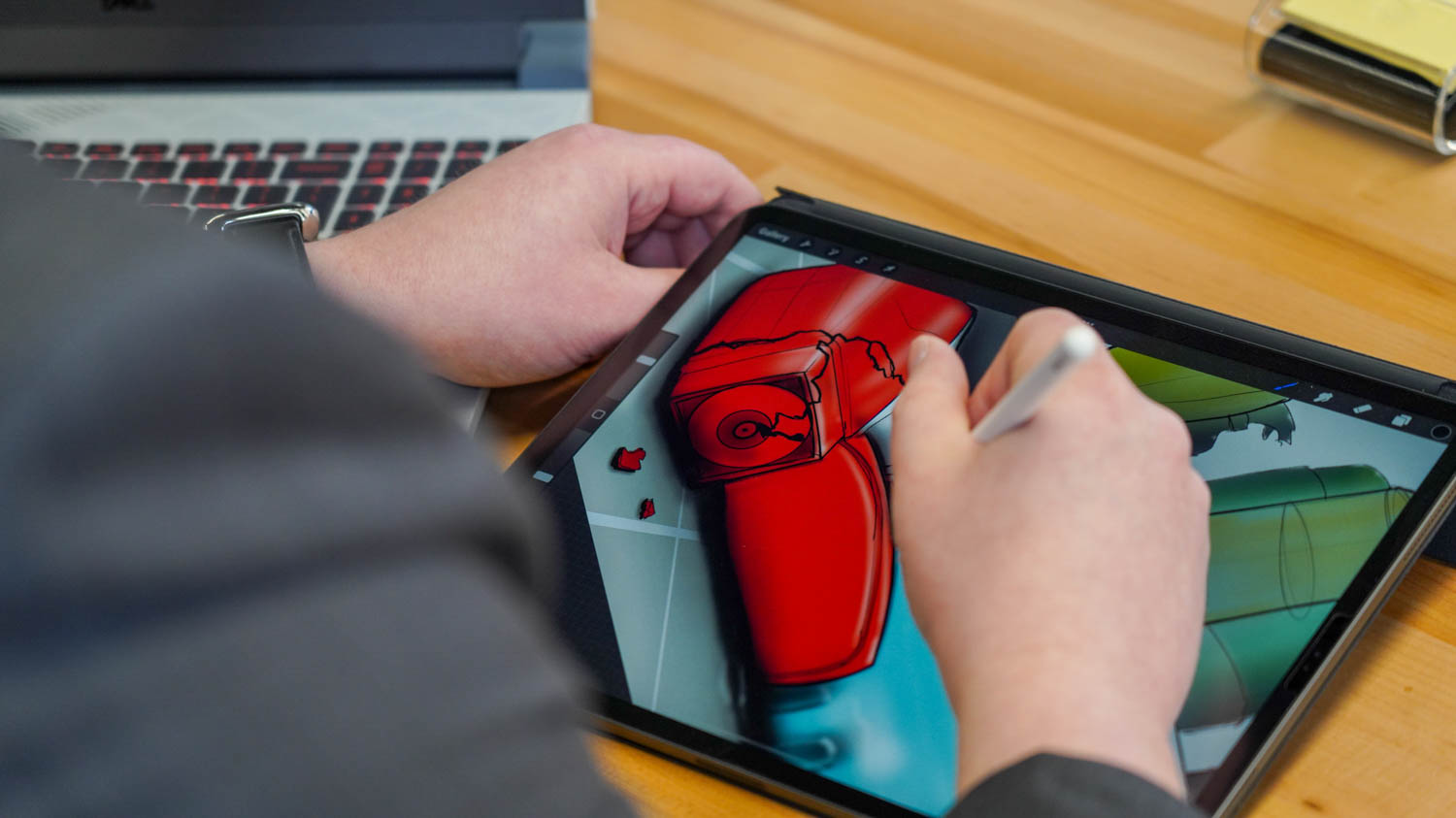 student drawing on ipad